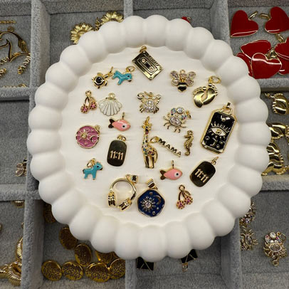 Variety of charms on display for jewelry in Prague