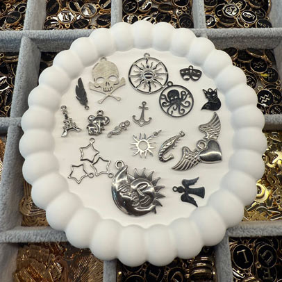 Stainless steel souvenir charms available at Charm Bar Prague
