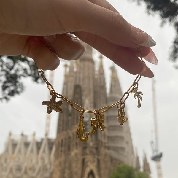 Charm Bar Prague bracelet worn in front of Sagrada Familia