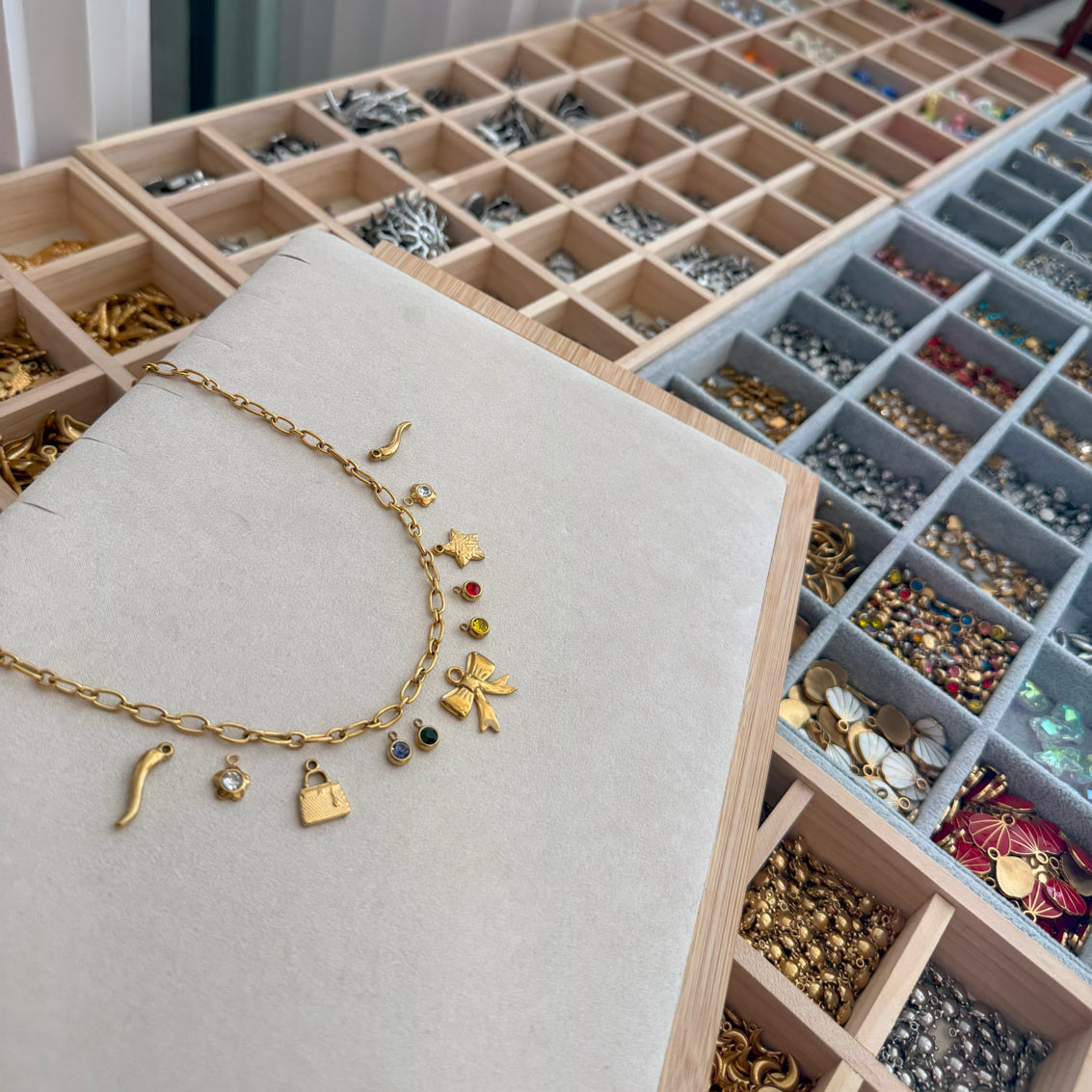 Charm selection and custom necklace creation at Charm Bar Prague
